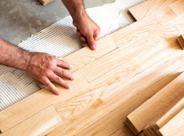 Assembly of patterned wood surface on a stable mixture subfloor glue